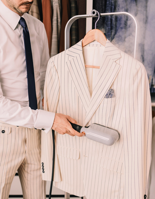 IZZI garment steamer in action beautifying clothing items